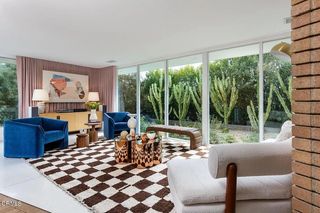 Mandy Moore's living room looking onto a cacti patch