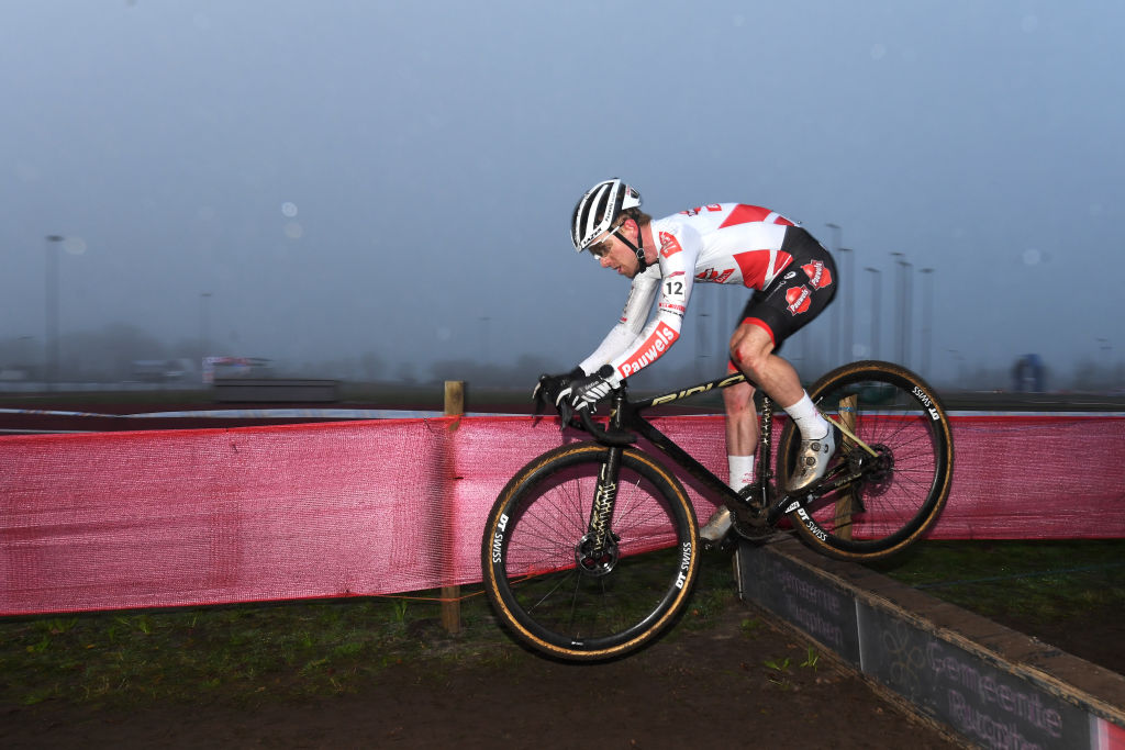 RUCPHEN NETHERLANDS DECEMBER 18 Eli Iserbyt of Belgium and Team Pauwels Sauzen Bingoal competes during the 9th Rucphen UCI CycloCross Worldcup 2021 Mens Elite CXWorldCup UCIcyclocrossWC on December 18 2021 in Rucphen Netherlands Photo by Luc ClaessenGetty Images