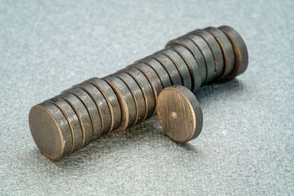 A row of small round metal magnets