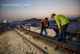 Engineers work to install part of the Hyperloop One test track at a site in the desert located about 30 minutes from Las Vegas.