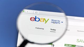 Image showing eBay homepage with magnifying glass highlighting the logo