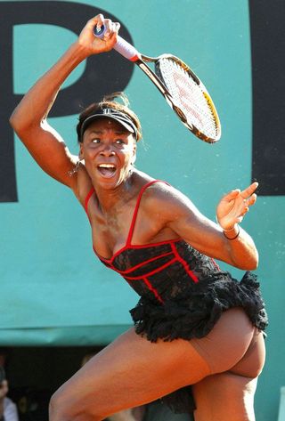 Venus Williams swinging a tennis racket.