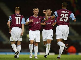 Tottenham Hotspur Sergei Rebrov (2nd from L) of West Ham United celebrates with his team-mates after scoring their third goal during the Carling Cup second round match between West Ham United and Notts County at Upton Park on September 21, 2004 in London. (Photo by Paul Gilham/Getty Images)