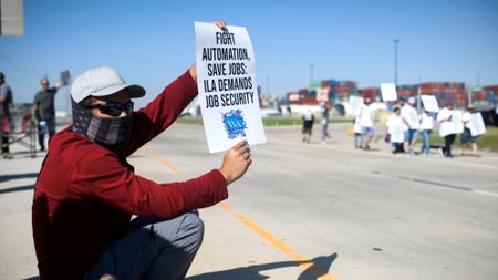 Union dockworker demonstrates outside port