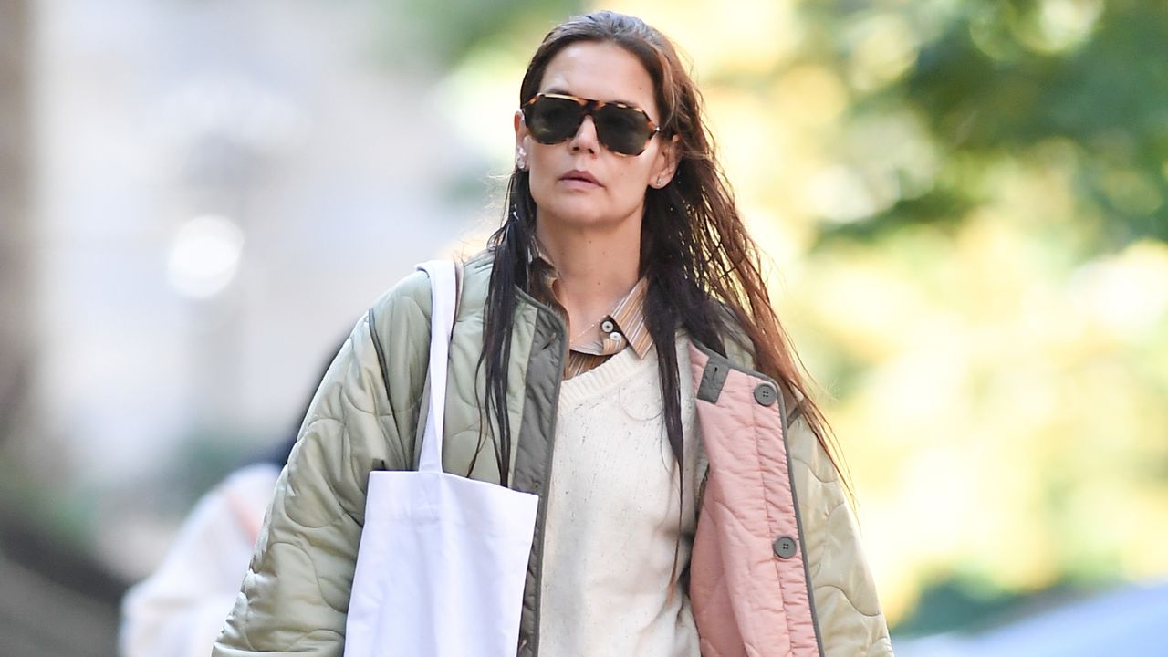 Katie Holmes wearing a quilted jacket with three shirt layers in new york city