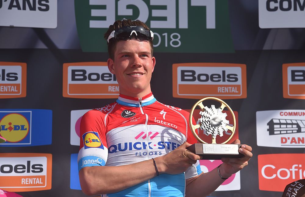 Bob Jungels (Quick-Step Floors) holds up his trophy after he wins Liege-Bastogne-Liege