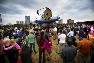 Nobel Laureate John Mather and Northrop Grumman engineer Scott Willoughby talk to a crowd gathered around a model of NASA's James Webb Space Telescope at South by Southwest on March 9, 2013.