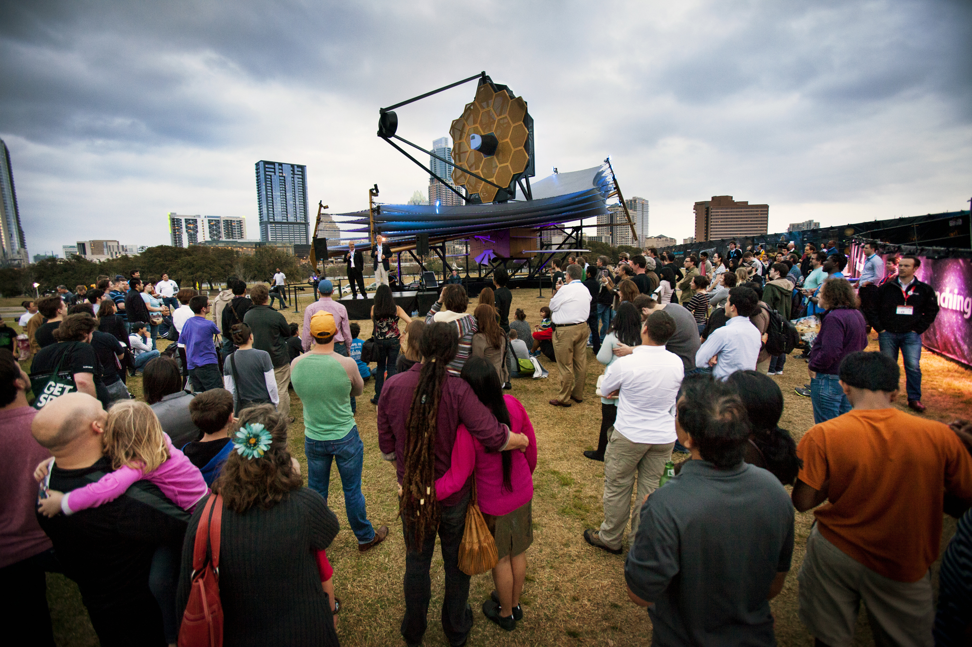 Nobel Laureate John Mather and Northrop Grumman engineer Scott Willoughby talk to a crowd gathered around a model of NASA&#039;s James Webb Space Telescope at South by Southwest on March 9, 2013.