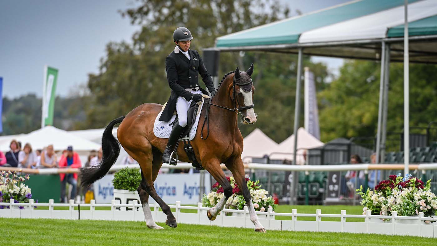 Bradeley Law and Michael Owen pictured competing in the dressage phase at the 2023 Defender Burghley Horse Trials