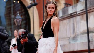 British actress Emma Watson poses on the red carpet upon arrival at the BAFTA British Academy Film Awards at the Royal Albert Hall, in London, on March 13, 2022.