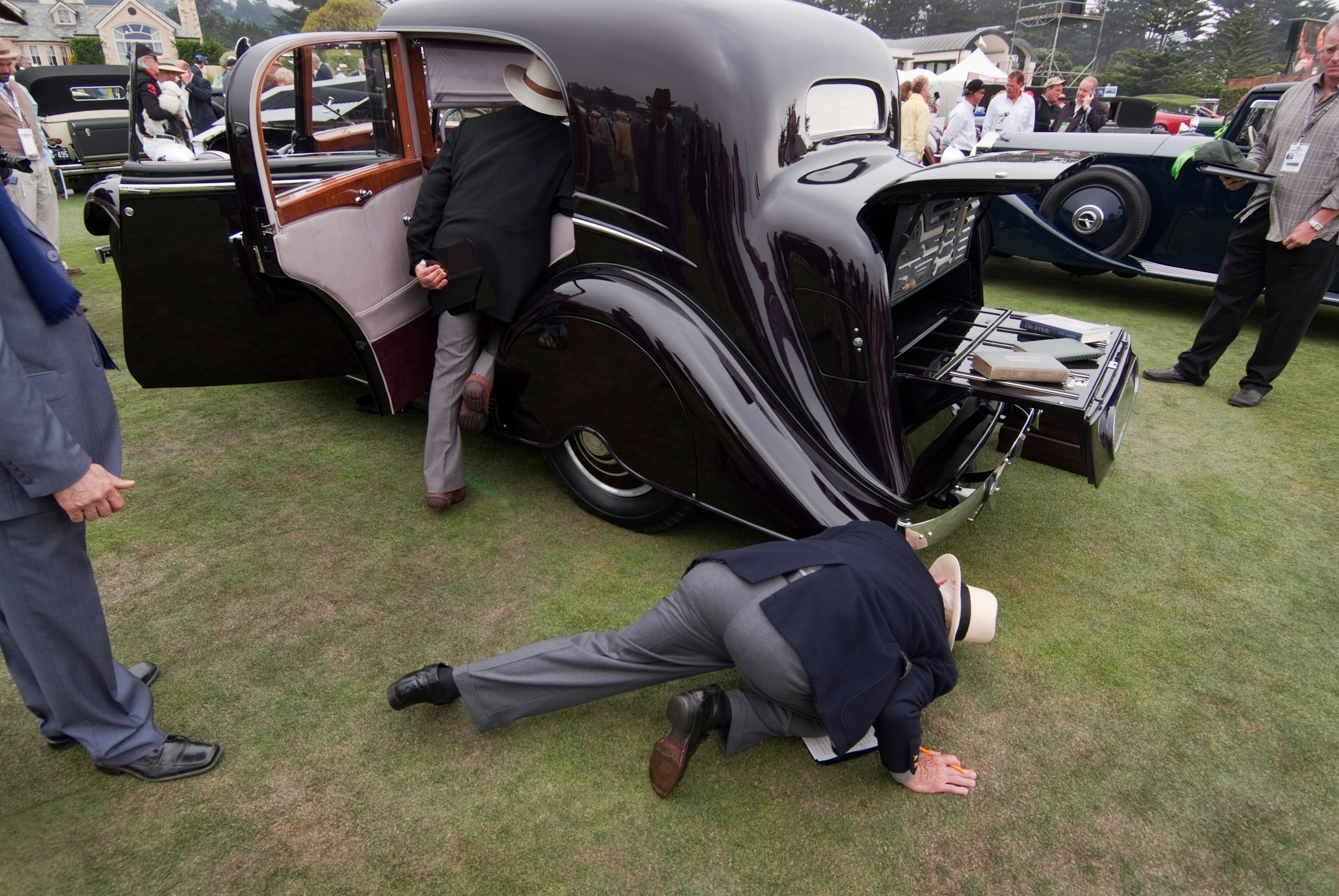 Concours judges inspecting a 1933 Rolls-Royce Phantom II Continental coupe
