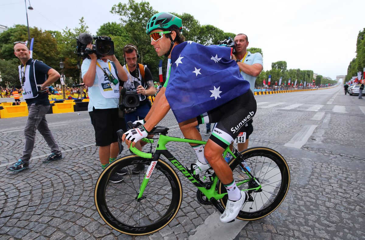 Michael Matthews (Team Sunweb) is draped in the Australian flag after winning the green jersey