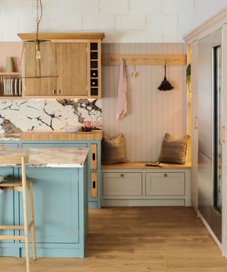 Taupe kitchen cabinets combined with blue cabinets and light wood