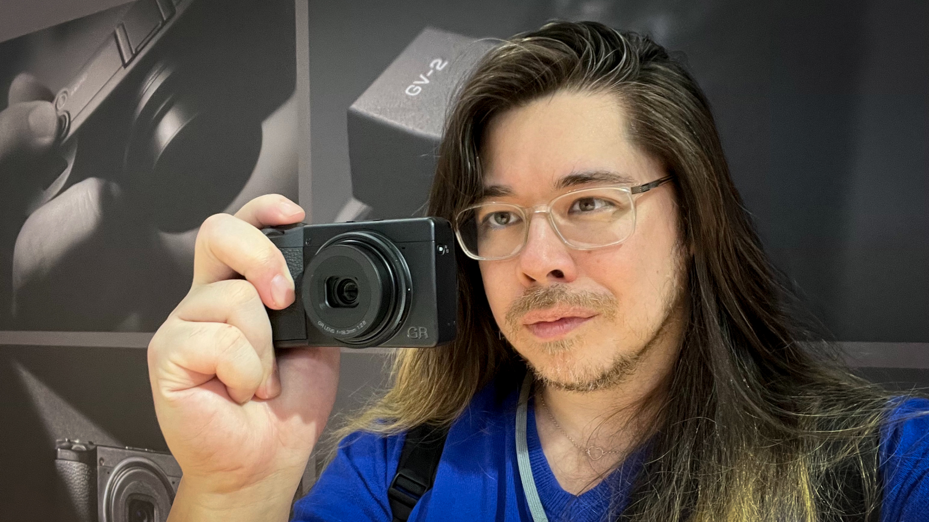 James Artaius holding a Ricoh GR IV Monochrome camera