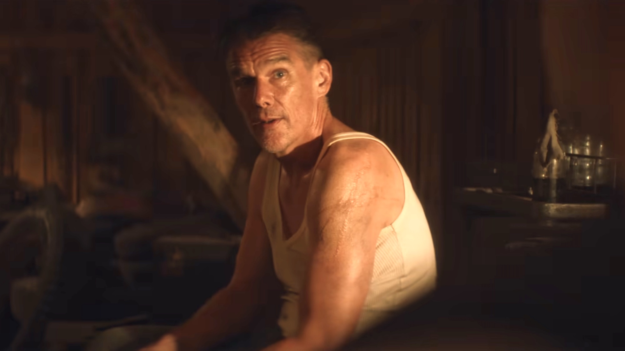 Ethan Hawke in a tank top in The Weight's trailer. 