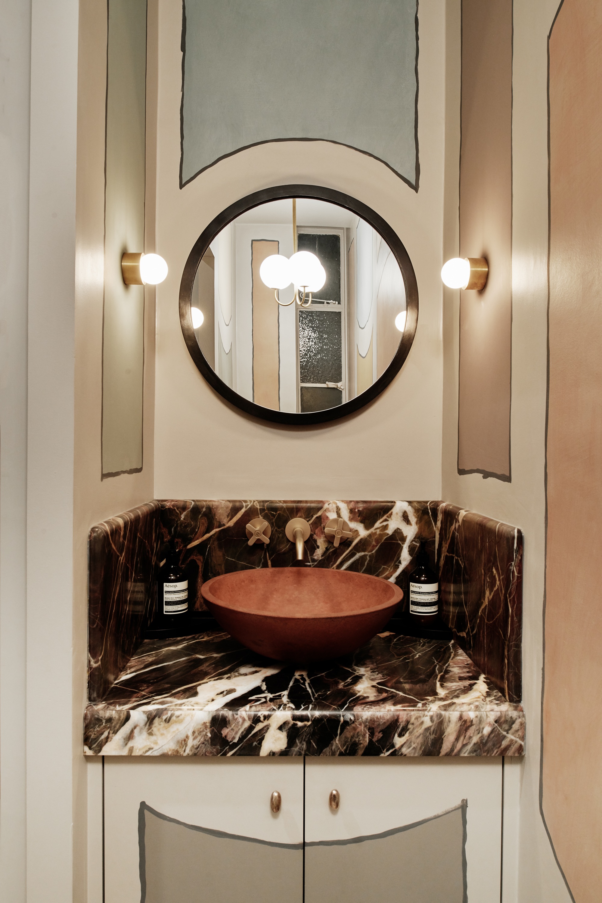 a vanity room with faux paneled walls and a marble countertop