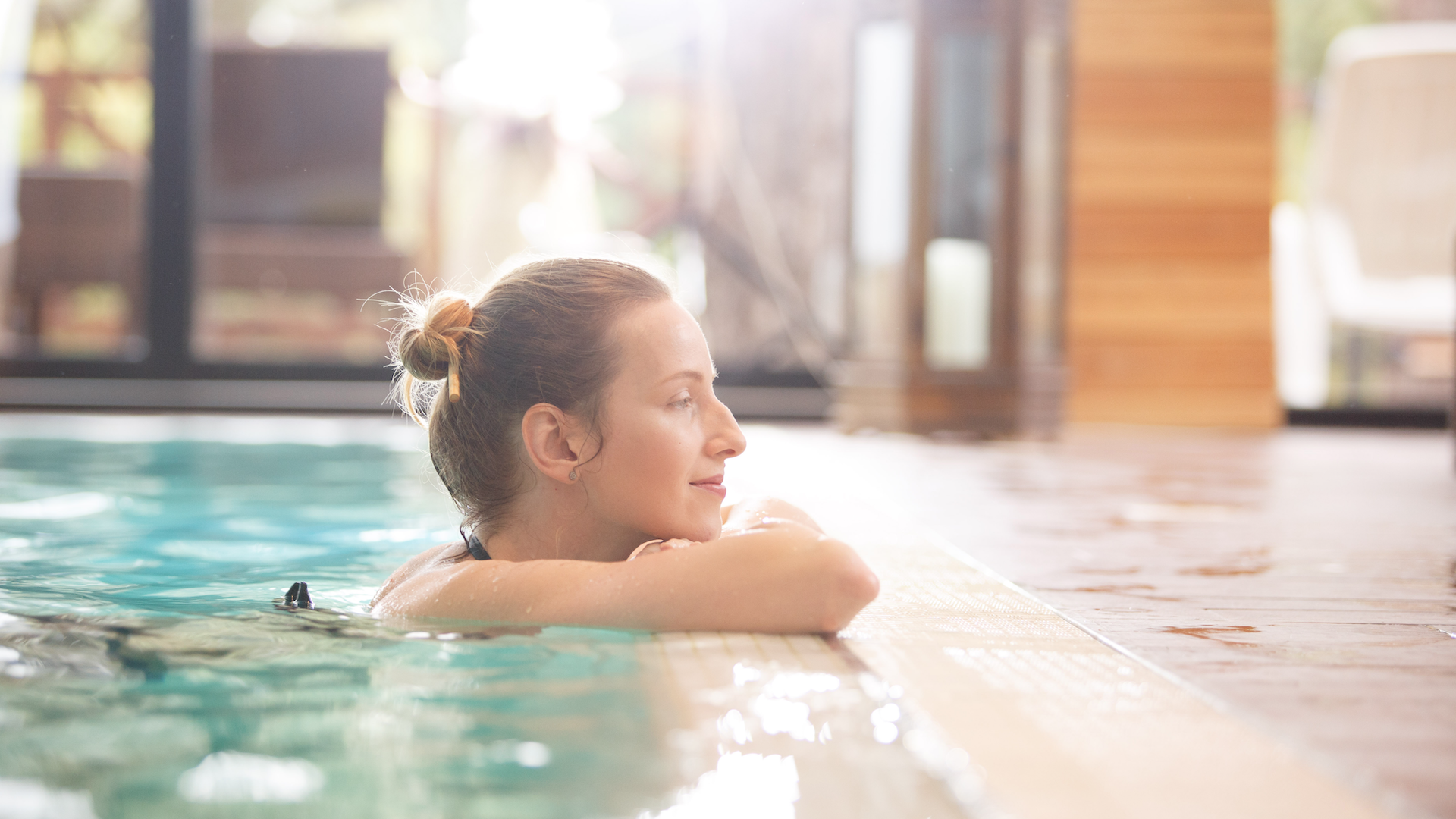 Woman enjoying time in pool at spa