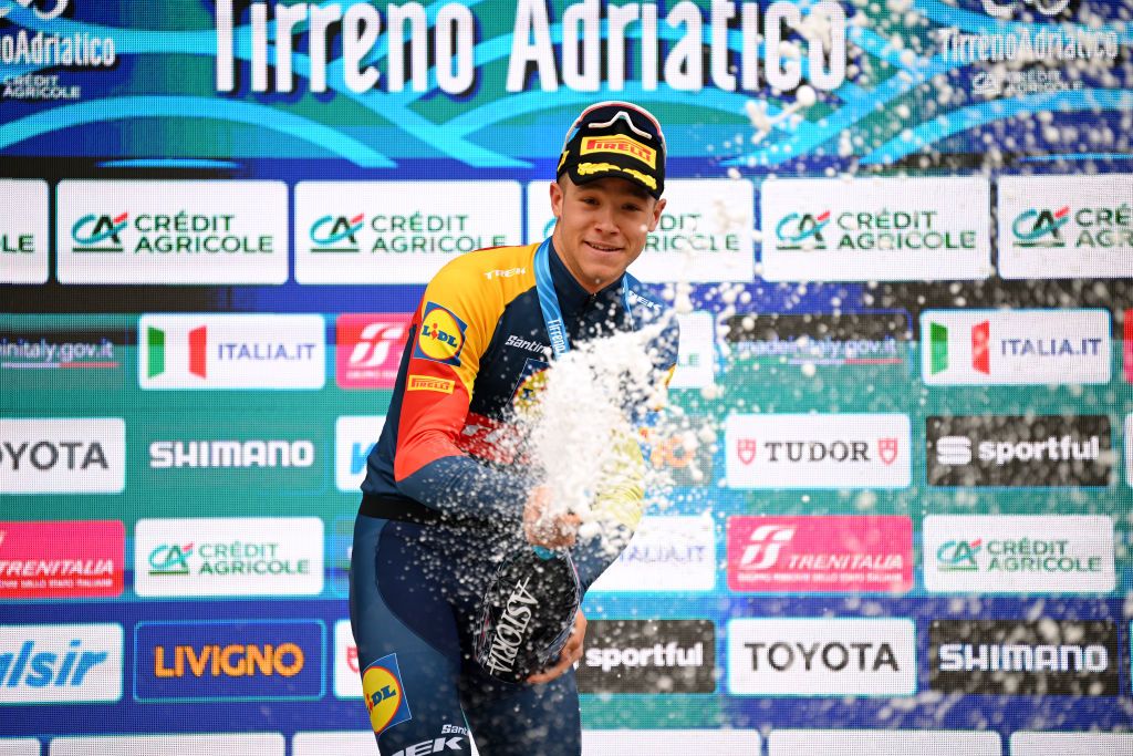 Jonathan Milan (Lidl-Trek) celebrates at podium as stage 7 winner