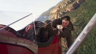 Tom Cruise hanging off a plane in Mission: Impossible -The Final Reckoning