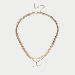 flat lay image of gold tone necklace