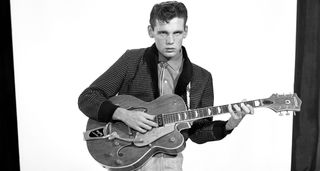 Duane Eddy, pictured in 1958, a black-and-white image with him playing a Gretsch guitar
