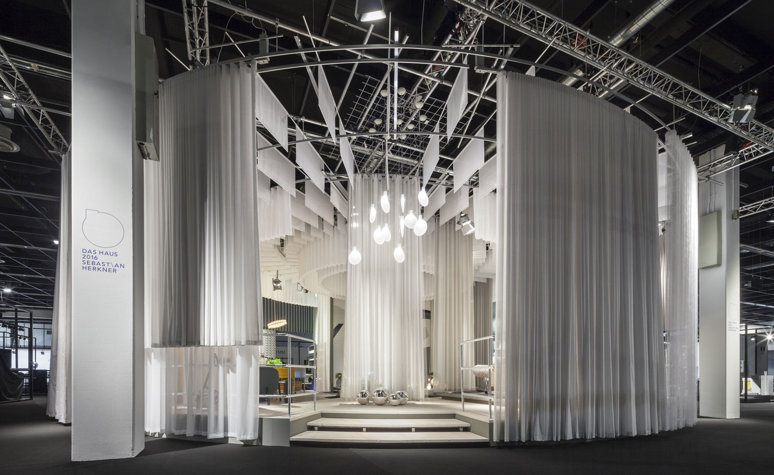 Mobile Nya Nordiska curtains and layers of Dinesen GrandDouglas flooring structure the space