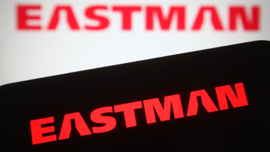 Eastman Chemical logo in red on a smartphone with a black background and blurred behind this with a white background.