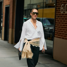 senior fashion editor Anna LaPlaca wearing a The Anteros white shirt with Moncler aviator sunglasses and a lace scarf belt