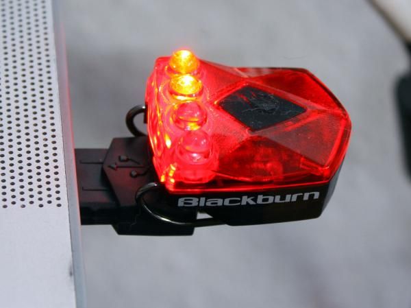 The miniscule Flea lights attach directly to the USB charger via magnetic contacts. Blinking LEDs indicate when the unit is charging and when charging is complete