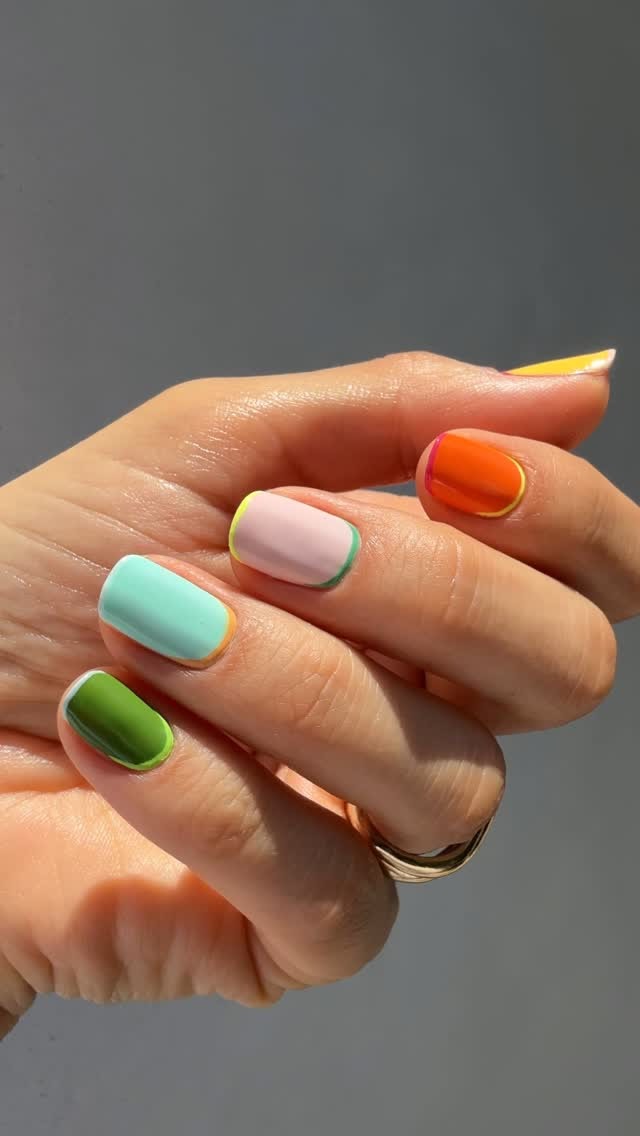 @betina_goldstein with a mismatched colourful French manicure