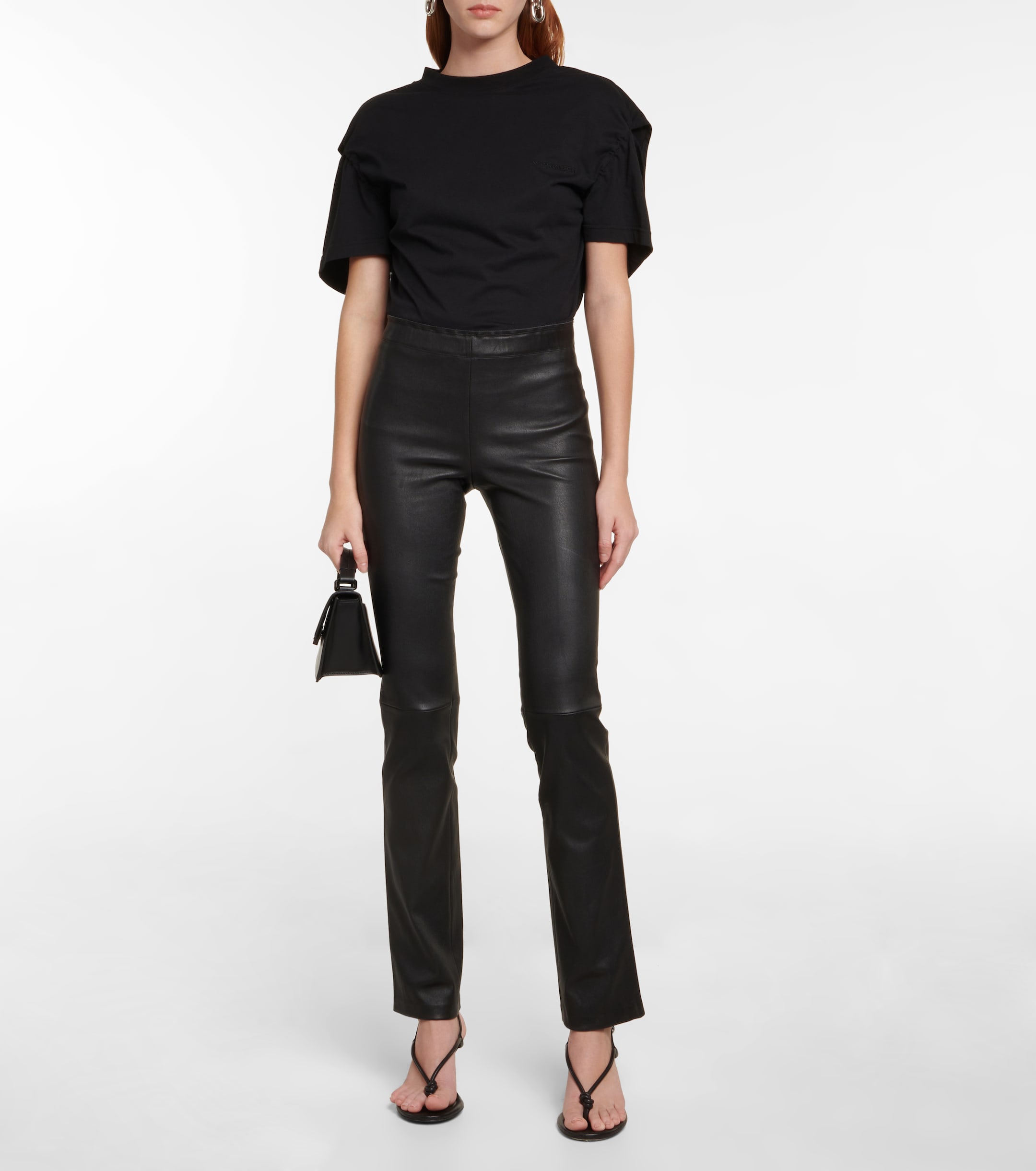 a model wearing stouls black leather trousers and a t-shirt