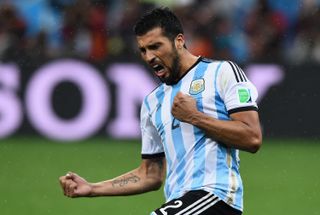 Ezequiel Garay celebrates after scoring his penalty for Argentina against the Netherlands in the shootout in the semi-finals of the 2014 World Cup in Brazil.