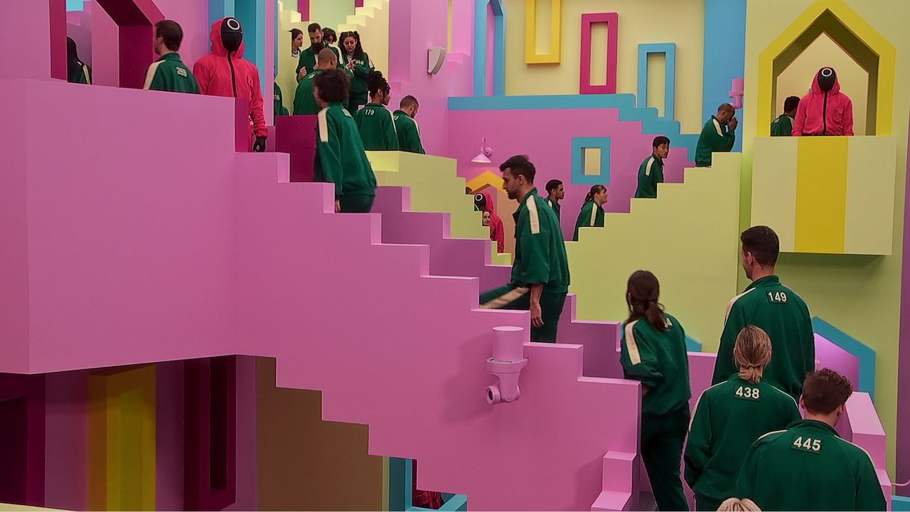 players walk up a staircase in squid game the challenge netflix