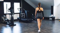 a woman exercising in her home gym