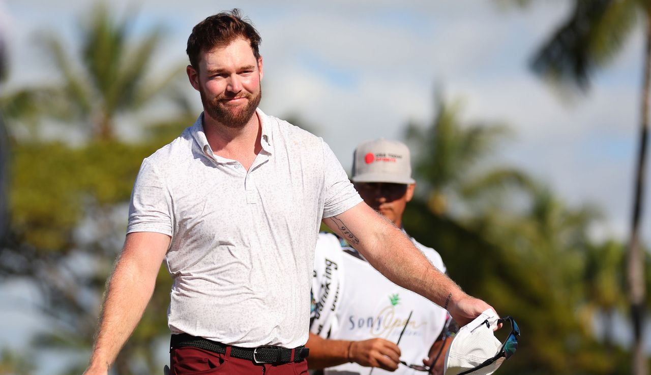 Grayson Murray smiles as he walks off the green