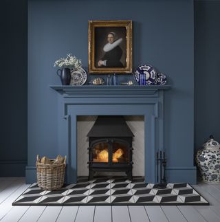 blue painted fireplace with tiled hearth and mantel