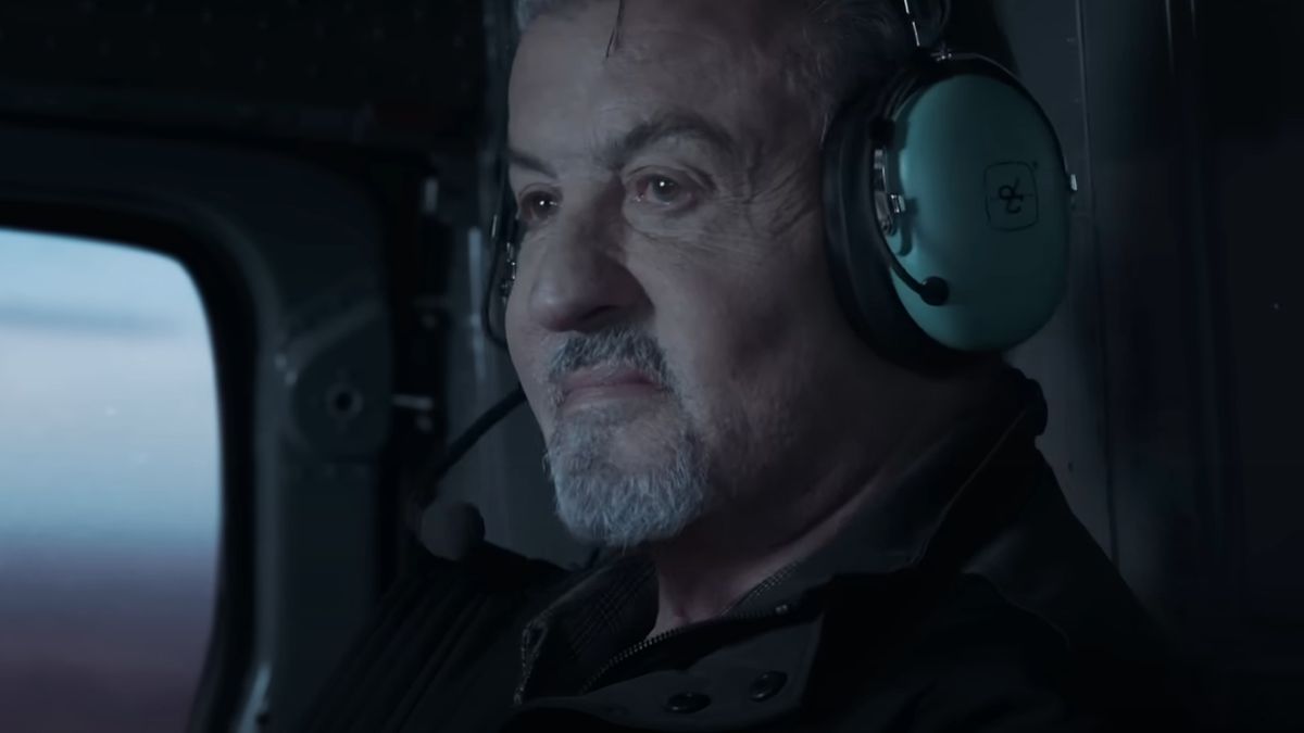 Sylvester Stallone wearing a headset in a plane in Alarum