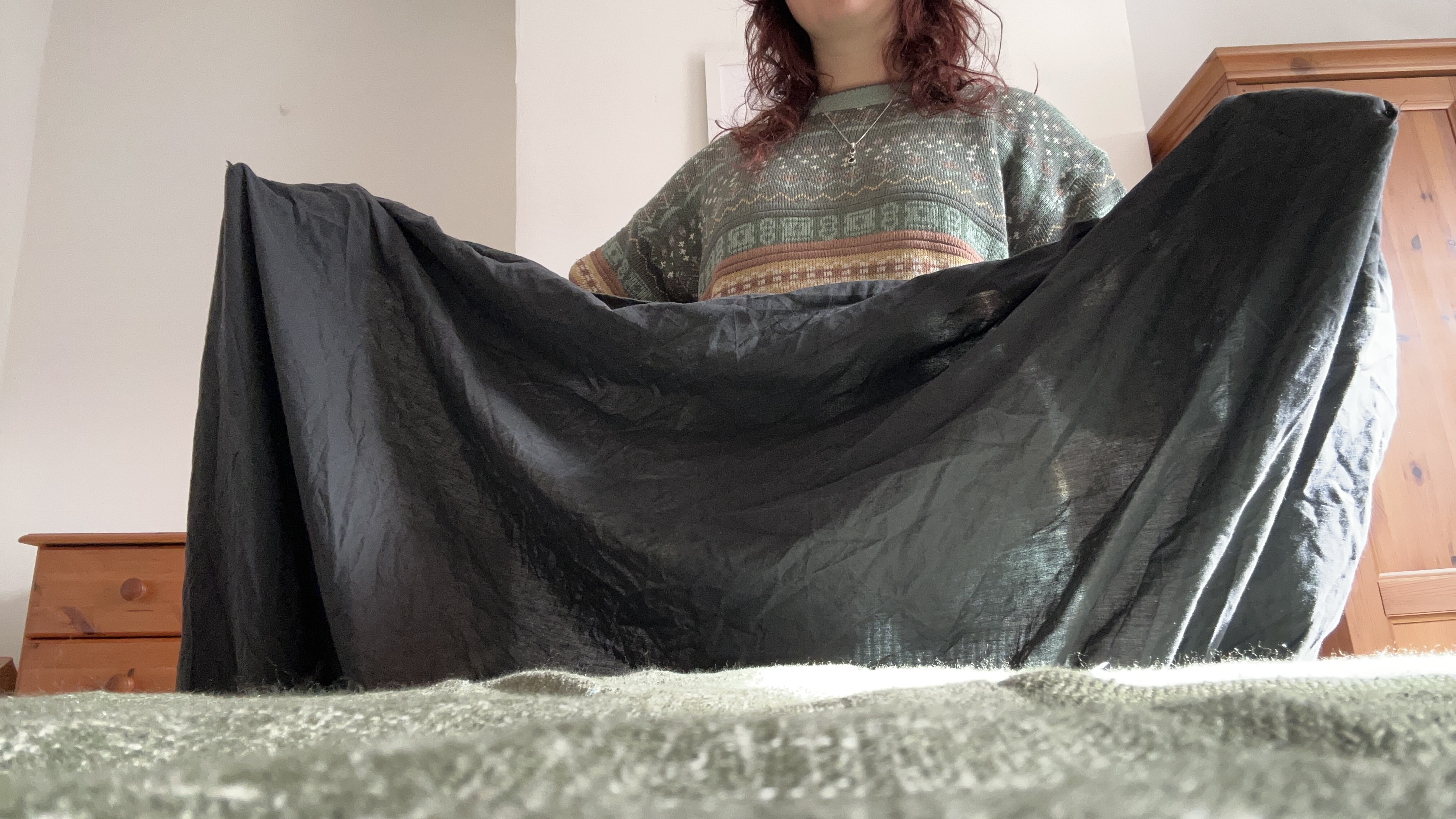 A Tom&#039;s Guide Sleep Features Editor Folding a fitted sheet