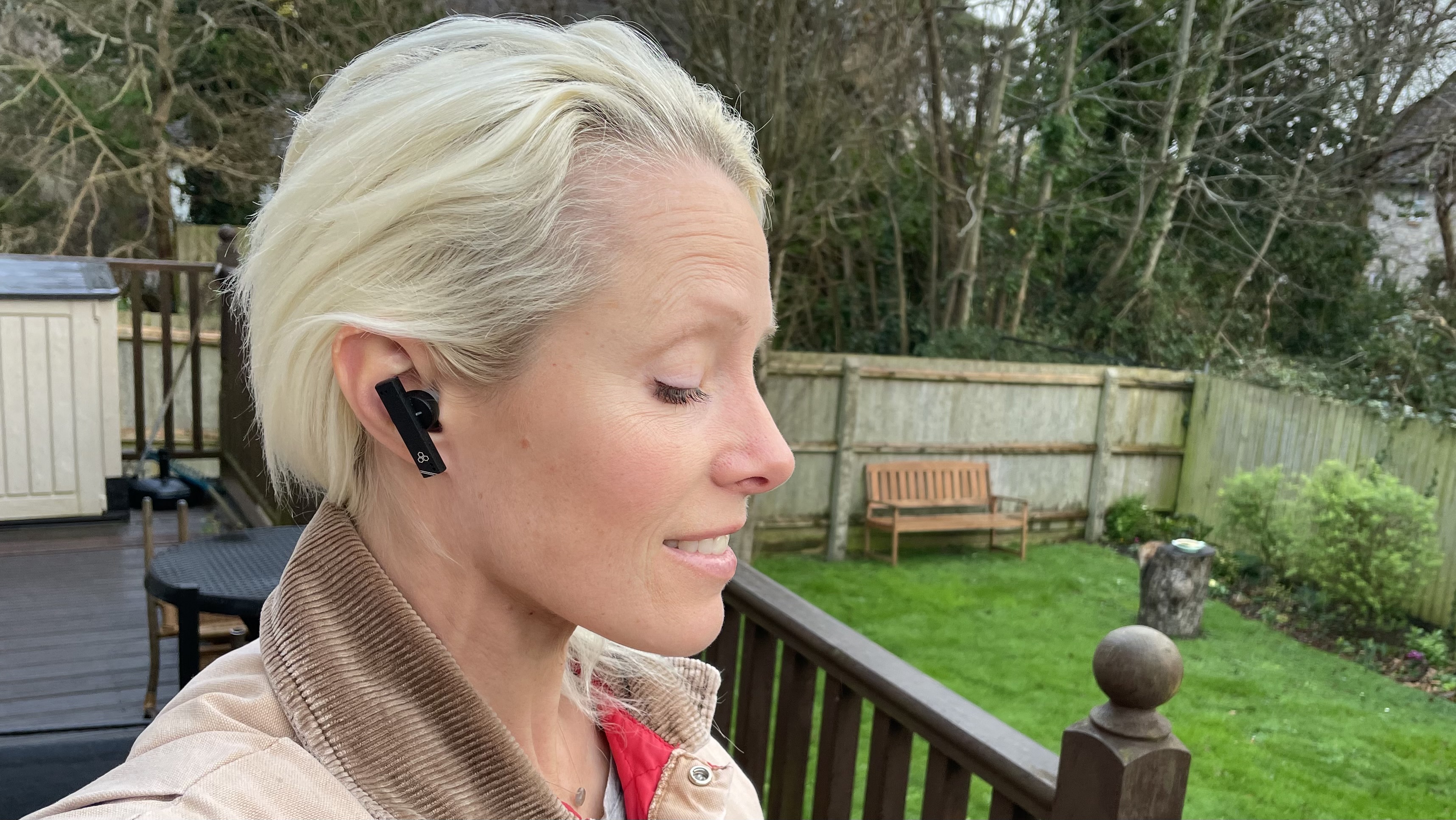 TechRadar's Becky Scarrott wearing the Final ZE8000 MK2 earbuds on a rainy day in the UK