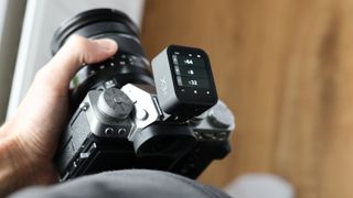 Godox X3 flash trigger mounted on a Fujifilm X-T5 camera