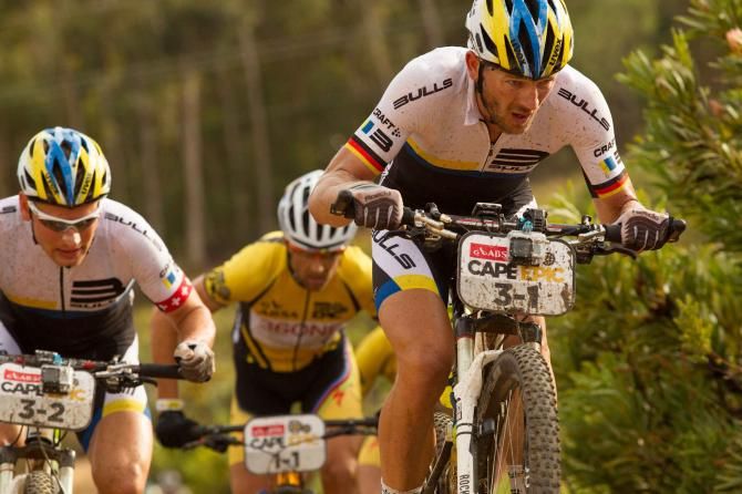 Karl Platt and Urs Huber of Team Bulls do al they can to break away from overall leaders Team Burry Stander-SONGO during stage 6 of the 2013 Cape Epic