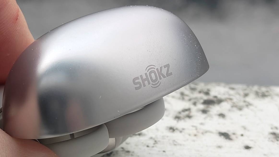 The Shokz OpenDots One on a white windowsill