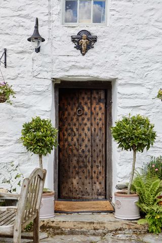 wooden front doors on a welsh cottage