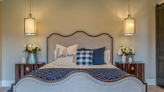 Elegant bedroom decor with suspended pendant lights over bedside tables showing key bedroom trend