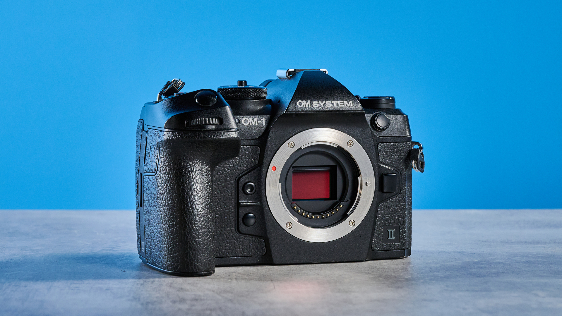 A black OM System OM-1 Mark II Micro Four Thirds mirrorless camera