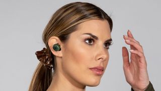 Women wearing JLab Go Air earbuds.