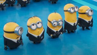 A line of Minions in black suits stand waiting for orders in Despicable Me 4.