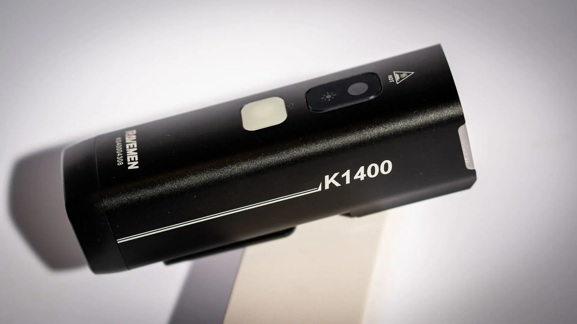 The Ravemen K1400 front bike light against the a plain white background