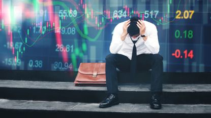 stressed businessman sitting on the walkway in panic digital stock market financial background