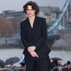 Timothée Chalamet in an Alexander McQueen striped suit for "Wonka" press tour